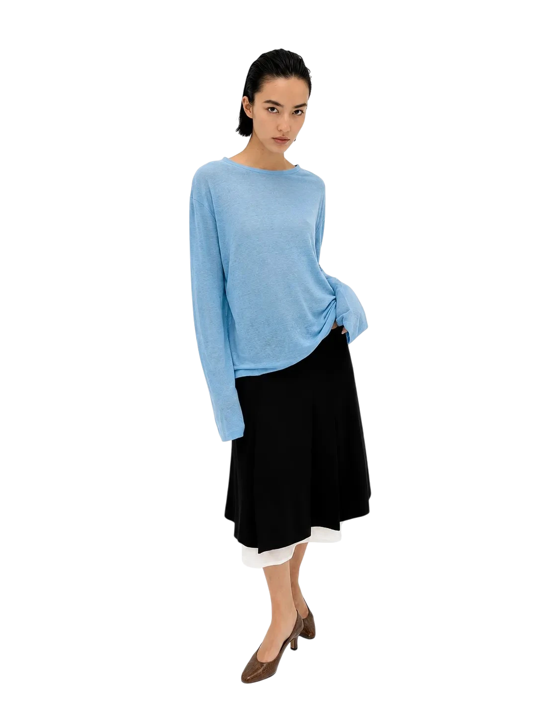 AI-generated model wearing a light blue sweater and a black midi skirt