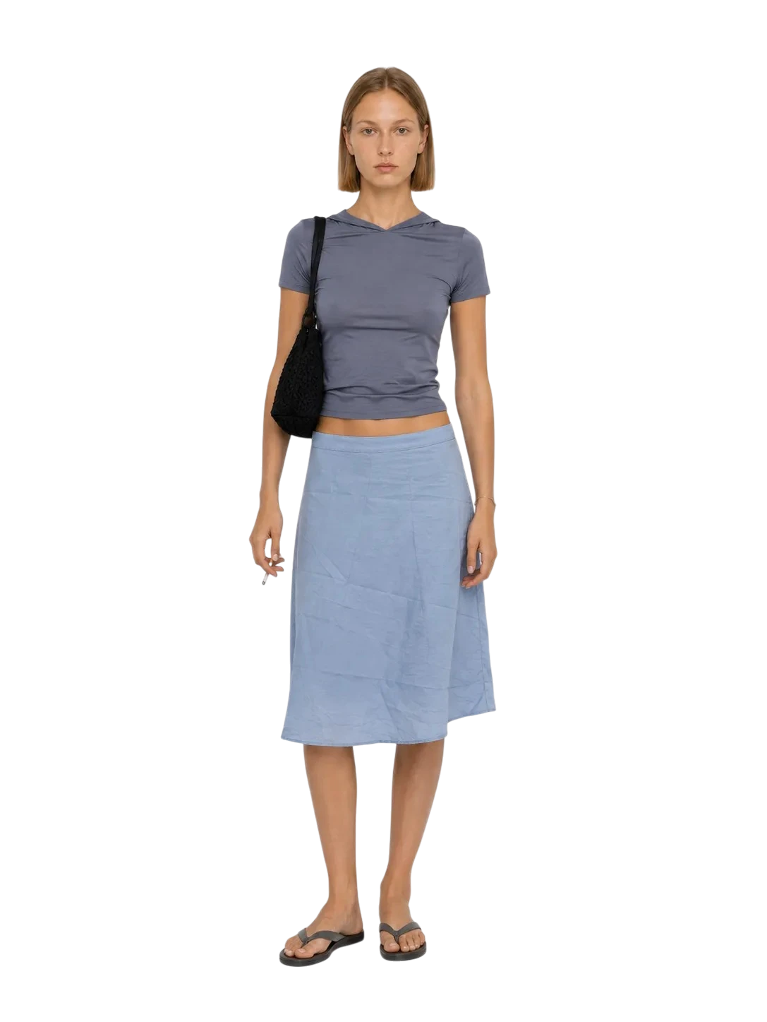 AI-generated model wearing a grey hooded tee and a light blue midi skirt